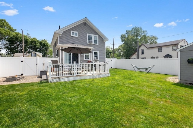10 Saunders Rd, Lynn, MA 01904 - rear view of property with a gate, a wooden deck, a fenced backyard, and a fire pit