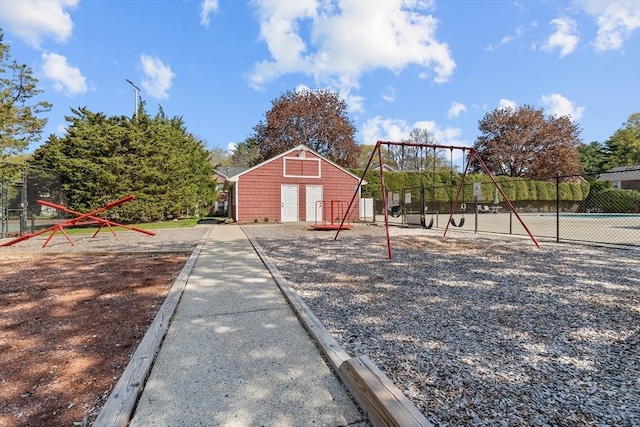 view of yard with fence and an outdoor structure