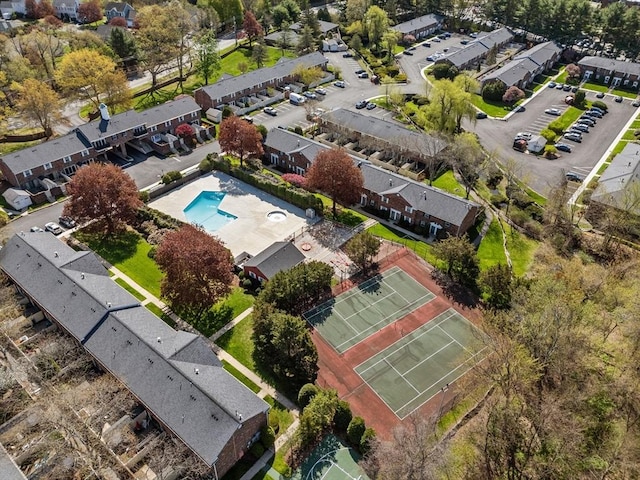 aerial view of property and surrounding area featuring a pool