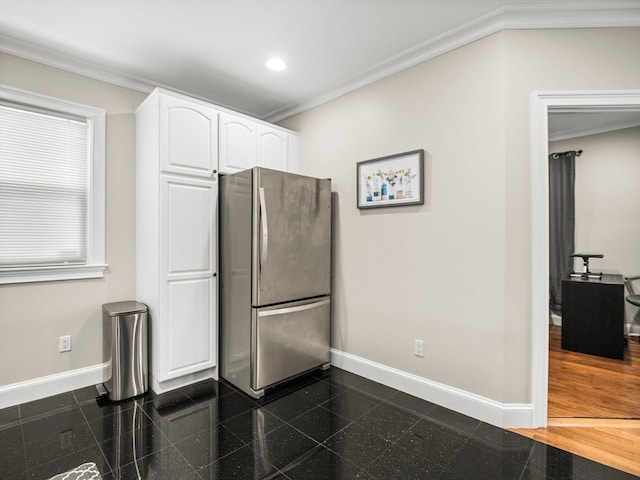 interior space with stainless steel fridge, dark wood-type flooring, white cabinetry, and crown molding