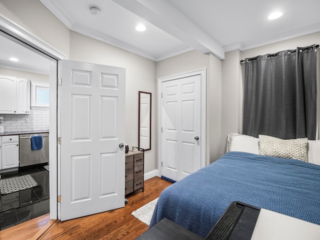 bedroom featuring beamed ceiling, a closet, crown molding, and hardwood / wood-style flooring