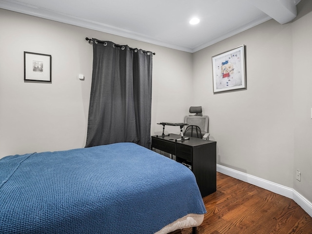 bedroom with ornamental molding and hardwood / wood-style flooring