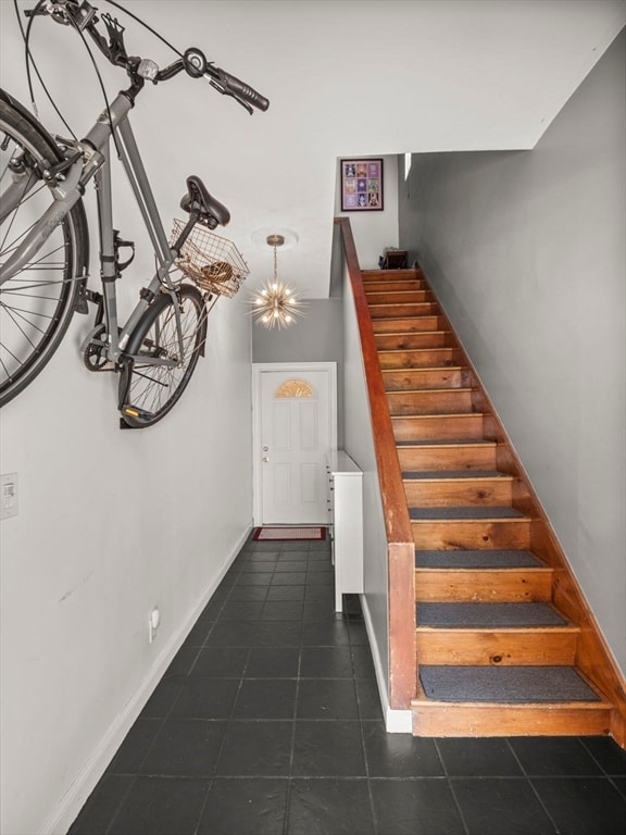 staircase featuring tile patterned floors