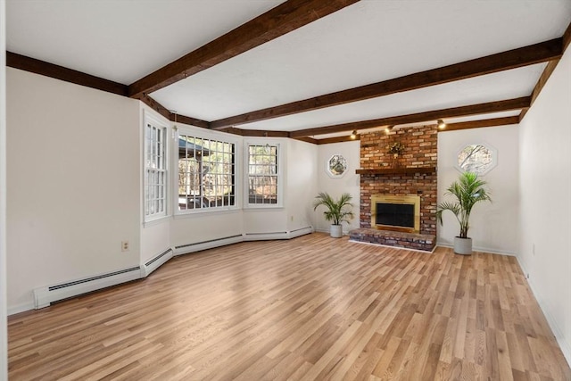 unfurnished living room featuring beamed ceiling, light wood-type flooring, a baseboard radiator, and a brick fireplace