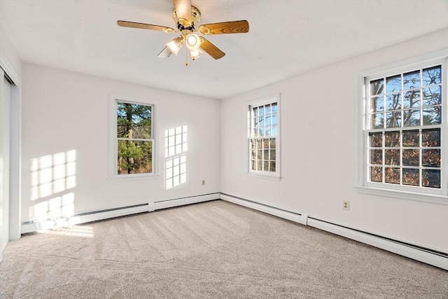 unfurnished room with carpet flooring, a wealth of natural light, and ceiling fan