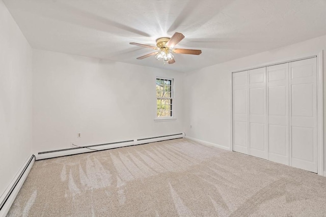 unfurnished bedroom featuring carpet flooring, ceiling fan, a closet, and a baseboard radiator