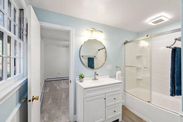 bathroom featuring vanity, wood-type flooring, shower / bath combination with glass door, and a baseboard radiator