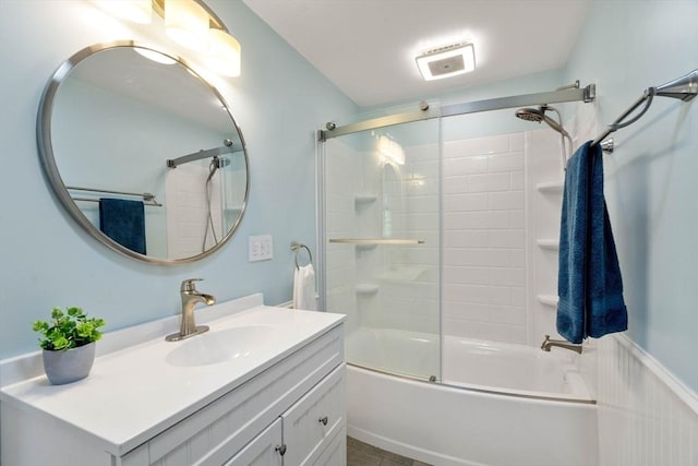 bathroom with vanity and shower / bath combination with glass door