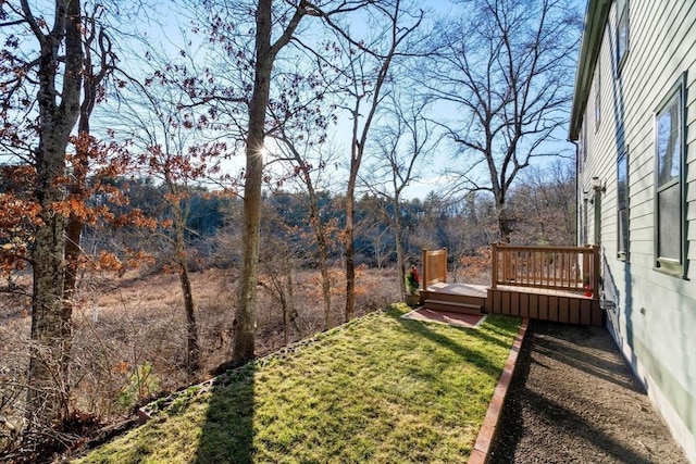 view of yard featuring a wooden deck