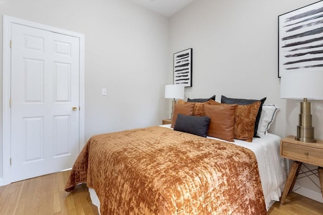 bedroom featuring light wood-style floors