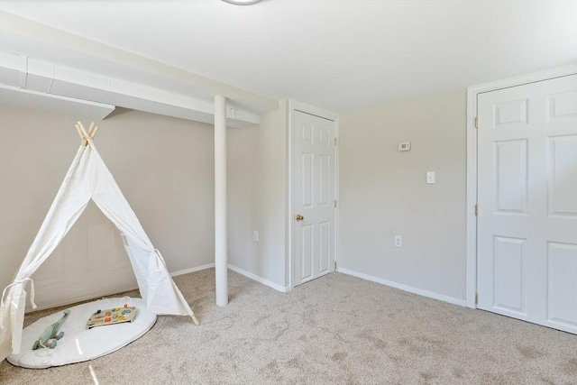 game room with carpet floors and baseboards