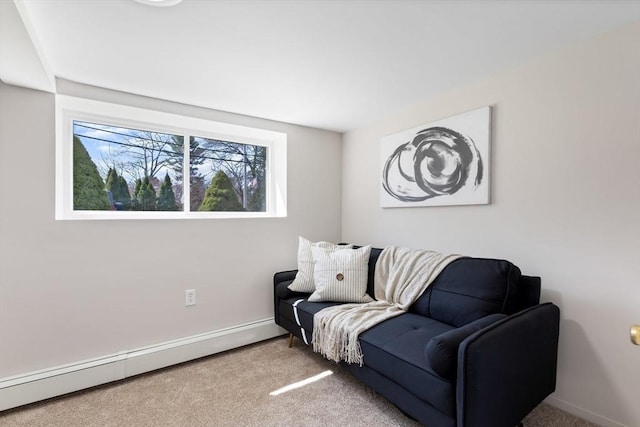 living area featuring baseboards, carpet, and baseboard heating