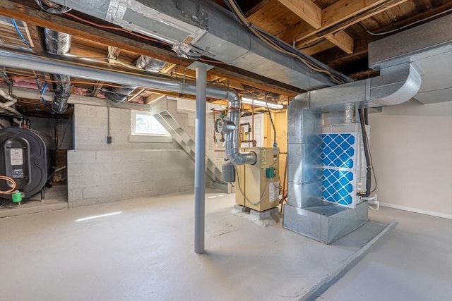 below grade area featuring heating unit and heating fuel