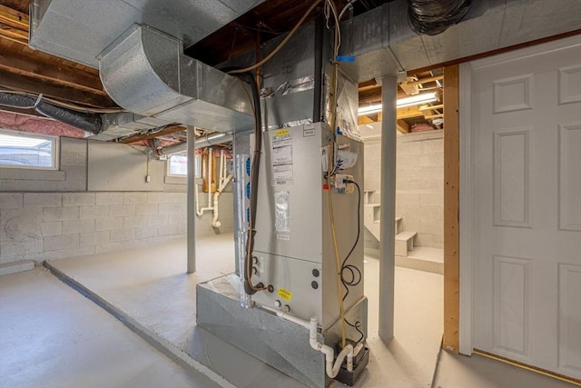 below grade area featuring heating unit