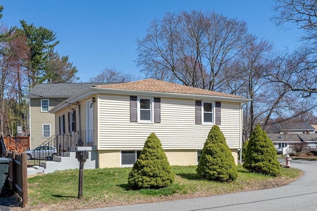 view of property exterior with a shingled roof