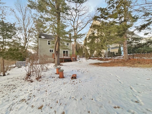 exterior space featuring fence and a deck