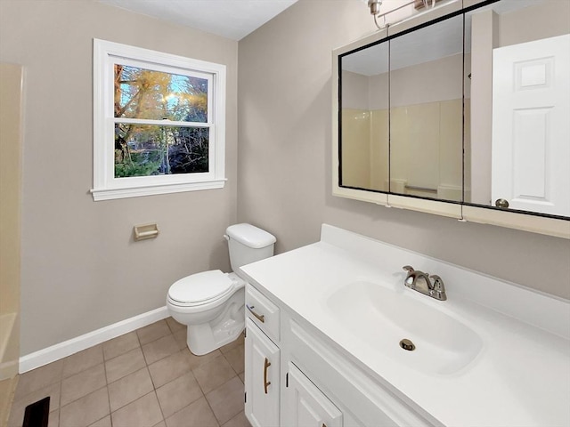 bathroom with a shower, baseboards, vanity, and toilet