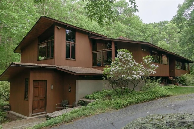 94 Bingham Rd, Carlisle, MA 01741 - view of front facade featuring a wooded view