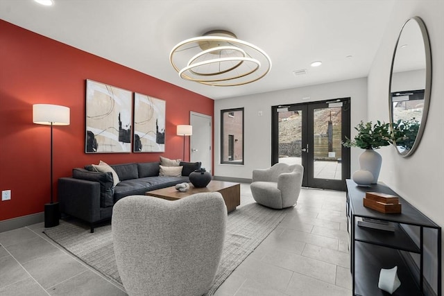 tiled living area with french doors, recessed lighting, a chandelier, and baseboards
