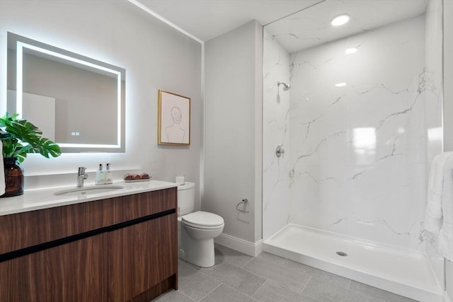 full bath featuring toilet, vanity, a marble finish shower, and tile patterned floors
