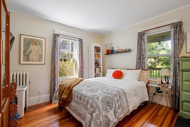 69 Bradfield Ave Unit 1, Boston, MA 02131 - bedroom featuring hardwood / wood-style floors, crown molding, and radiator heating unit