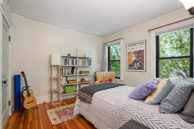 69 Bradfield Ave Unit 1, Boston, MA 02131 - bedroom with wood finished floors and crown molding