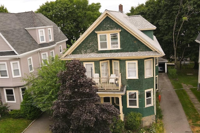 69 Bradfield Ave Unit 1, Boston, MA 02131 - view of front of home featuring a chimney and a balcony