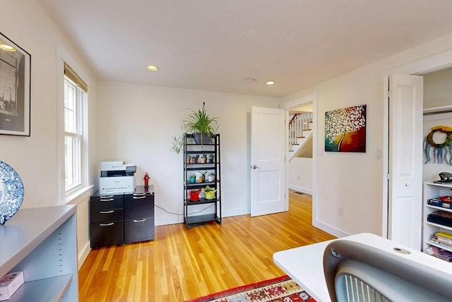 office featuring light wood finished floors, recessed lighting, and baseboards