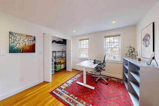 home office featuring recessed lighting, light wood-style flooring, and baseboards