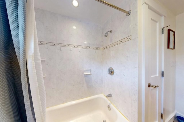 bathroom featuring shower / tub combo with curtain