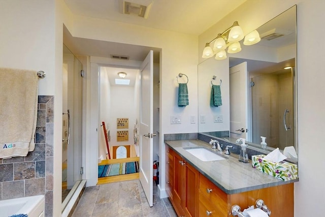 full bathroom featuring vanity, baseboards, visible vents, a shower stall, and a bath