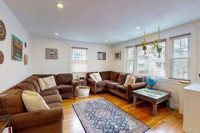 living room with recessed lighting and light wood-style floors