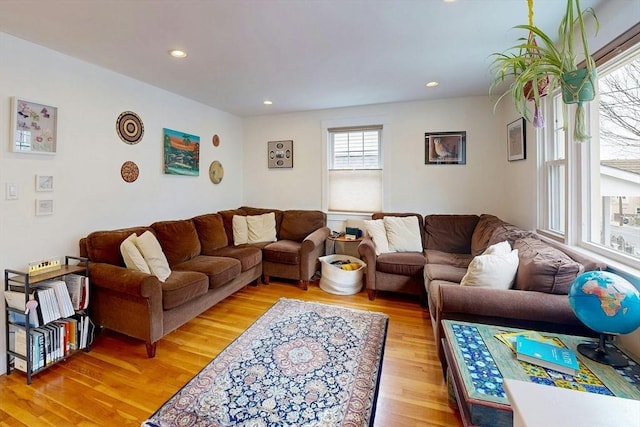 living room with recessed lighting and light wood-style floors