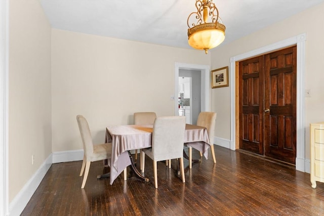 dining room with wood finished floors and baseboards