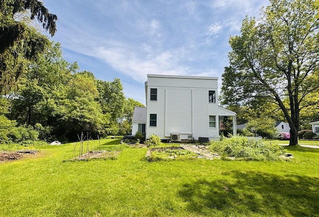 84 Walden Ter, Concord, MA 01742 - back of house with a lawn and central AC unit