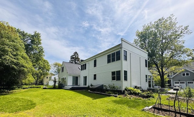 84 Walden Ter, Concord, MA 01742 - rear view of property featuring a yard and a garage