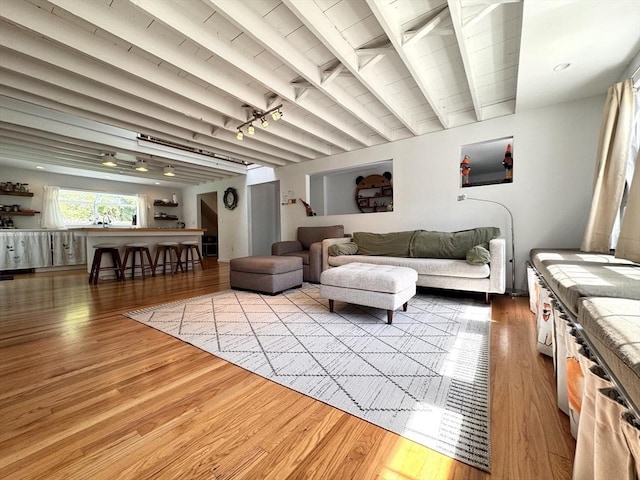 84 Walden Ter, Concord, MA 01742 - living area with light wood-style floors and beam ceiling