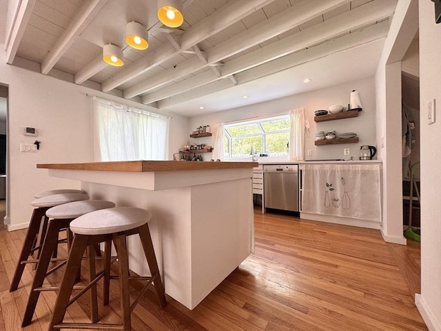 84 Walden Ter, Concord, MA 01742 - kitchen with dishwasher, open shelves, light wood finished floors, beam ceiling, and a breakfast bar area