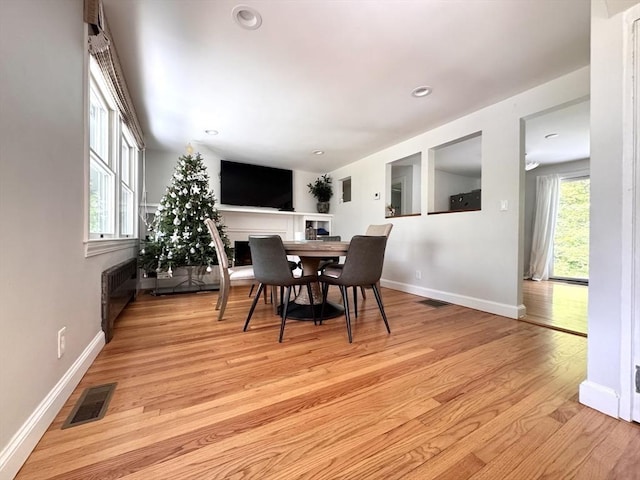 84 Walden Ter, Concord, MA 01742 - dining area with light wood-style flooring, radiator heating unit, baseboards, and recessed lighting