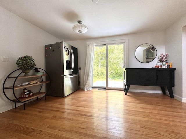 84 Walden Ter, Concord, MA 01742 - kitchen featuring stainless steel fridge with ice dispenser, light wood-type flooring, and baseboards