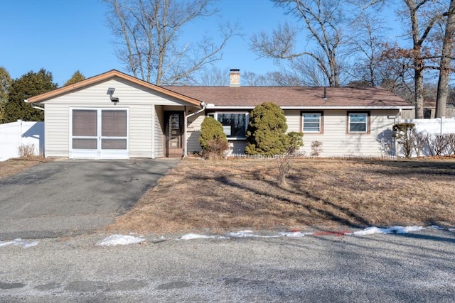 single story home with a garage