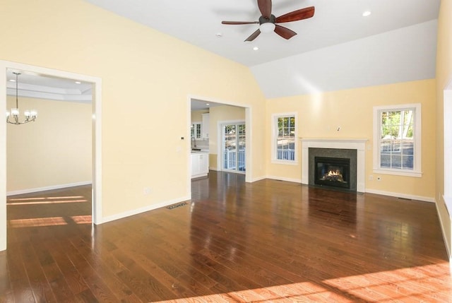 390 Marshall St, Leicester, MA 01524 - unfurnished living room with ceiling fan with notable chandelier, dark wood-type flooring, and vaulted ceiling