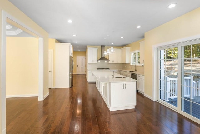 390 Marshall St, Leicester, MA 01524 - kitchen with a kitchen island with sink, wall chimney range hood, sink, stainless steel fridge, and decorative light fixtures