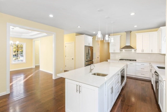 390 Marshall St, Leicester, MA 01524 - kitchen with appliances with stainless steel finishes, wall chimney exhaust hood, a raised ceiling, sink, and a center island with sink
