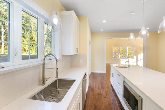 390 Marshall St, Leicester, MA 01524 - kitchen featuring sink, white cabinets, pendant lighting, and appliances with stainless steel finishes