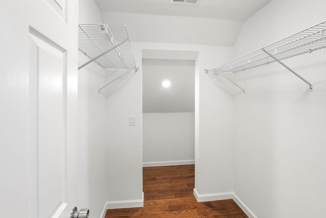 390 Marshall St, Leicester, MA 01524 - spacious closet featuring dark hardwood / wood-style flooring and vaulted ceiling