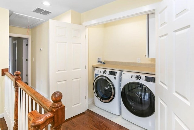 390 Marshall St, Leicester, MA 01524 - clothes washing area with washing machine and clothes dryer and dark hardwood / wood-style floors