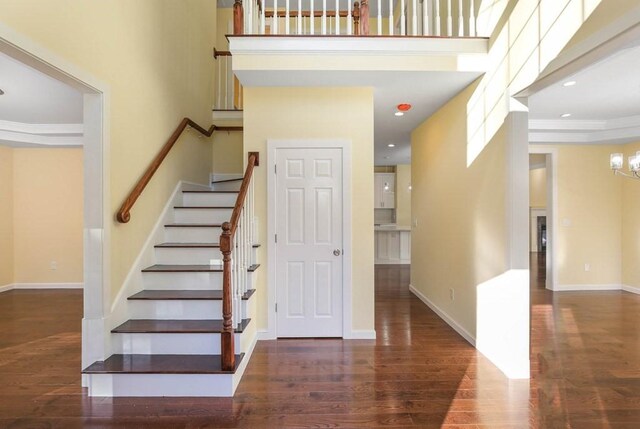 390 Marshall St, Leicester, MA 01524 - stairway with a chandelier, a high ceiling, and hardwood / wood-style floors