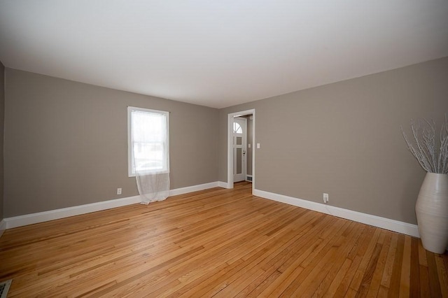 unfurnished room featuring light hardwood / wood-style floors