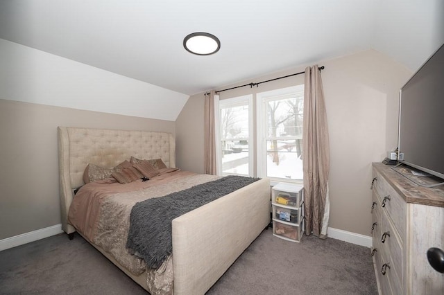 bedroom with light colored carpet and vaulted ceiling